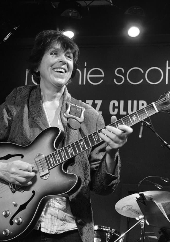 Deirdre Cartwright playing guitar