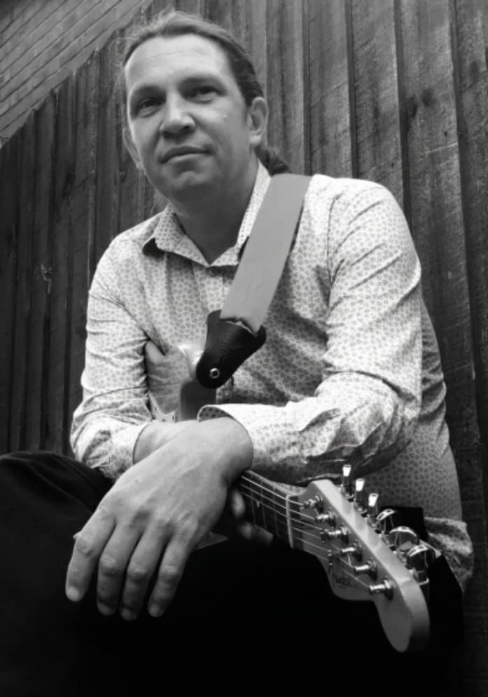 Jon Howells with his guitar